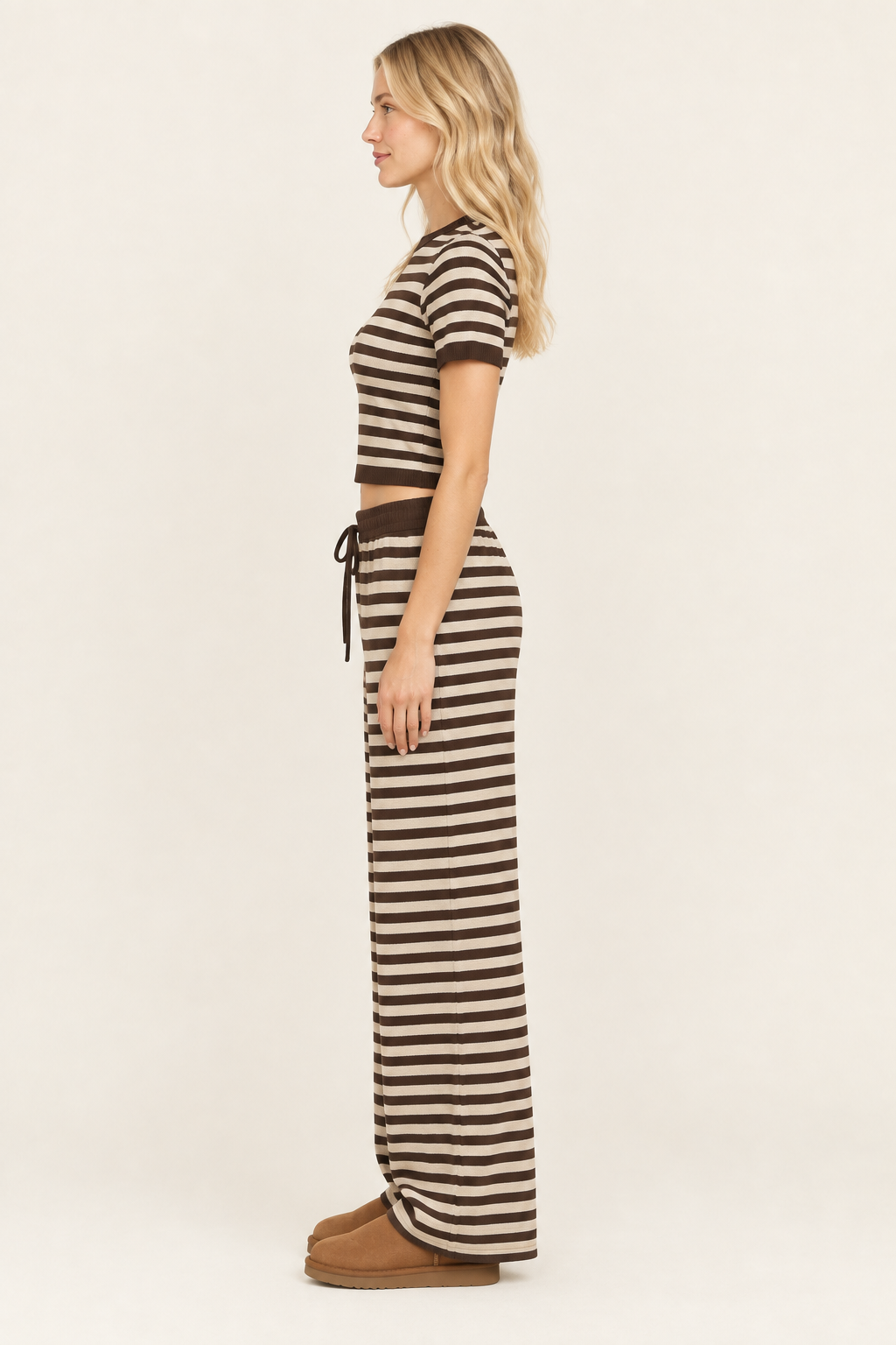 Blonde model in the striped outfit, shown from the side