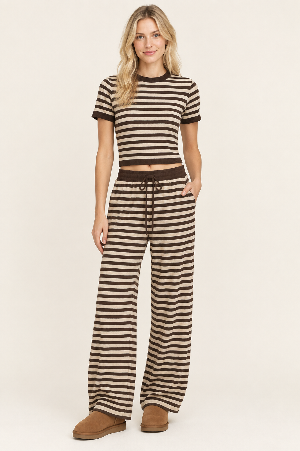 Blonde model wearing the striped outfit with chestnut boots