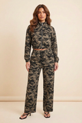 Camouflage two-piece set on the brunette model in a plain studio