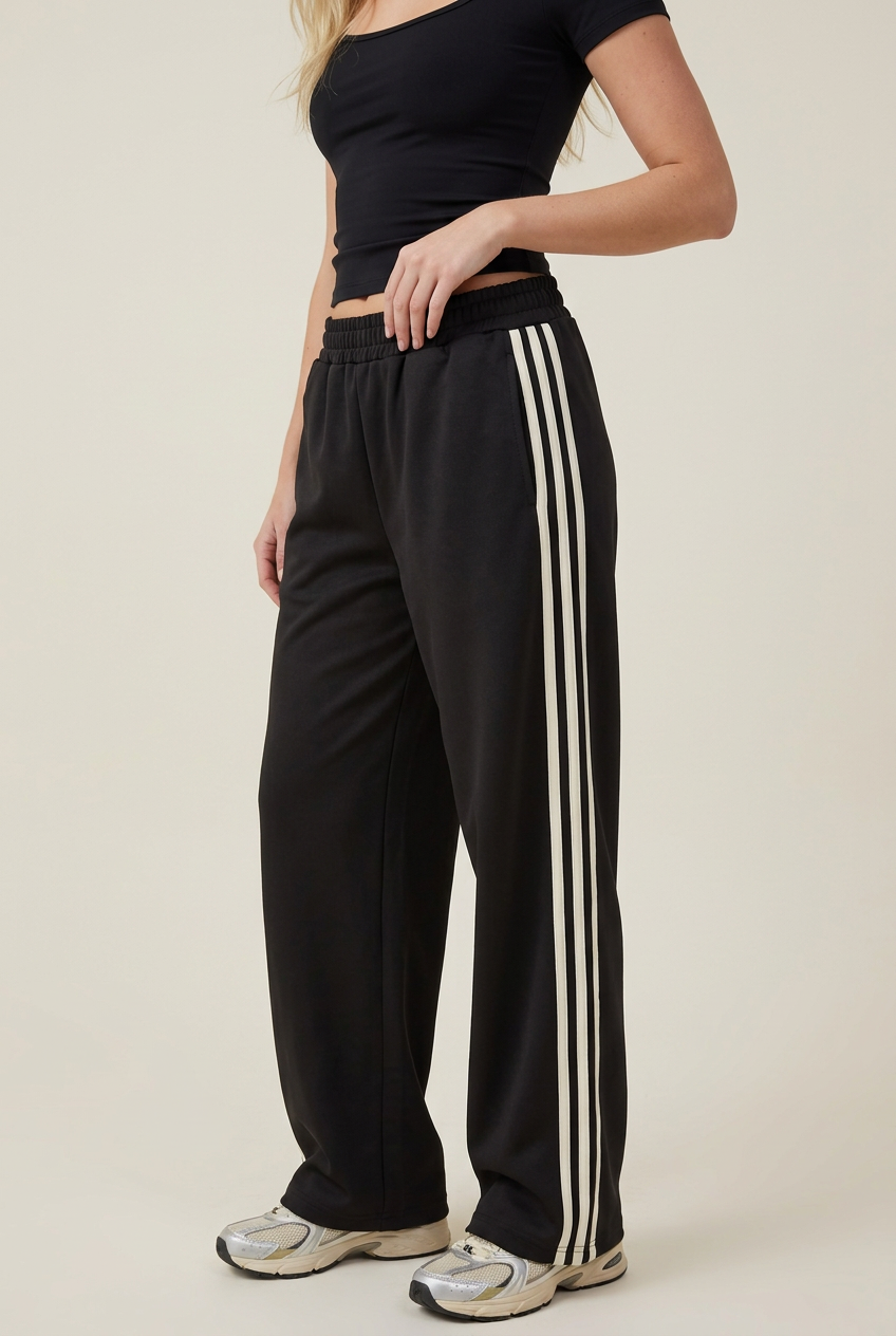 Close-up of the striped trousers in a new angled pose