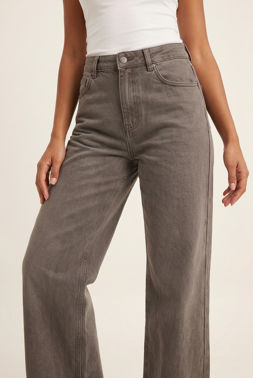 Close-up of the taupe-grey jeans in a new relaxed three-quarter pose