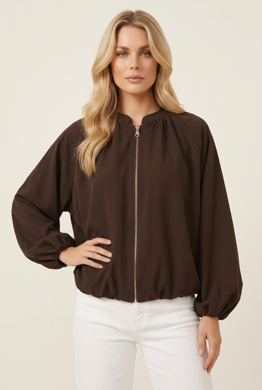 Close-up studio image of the chocolate-brown jacket, with the blonde model in a new pose