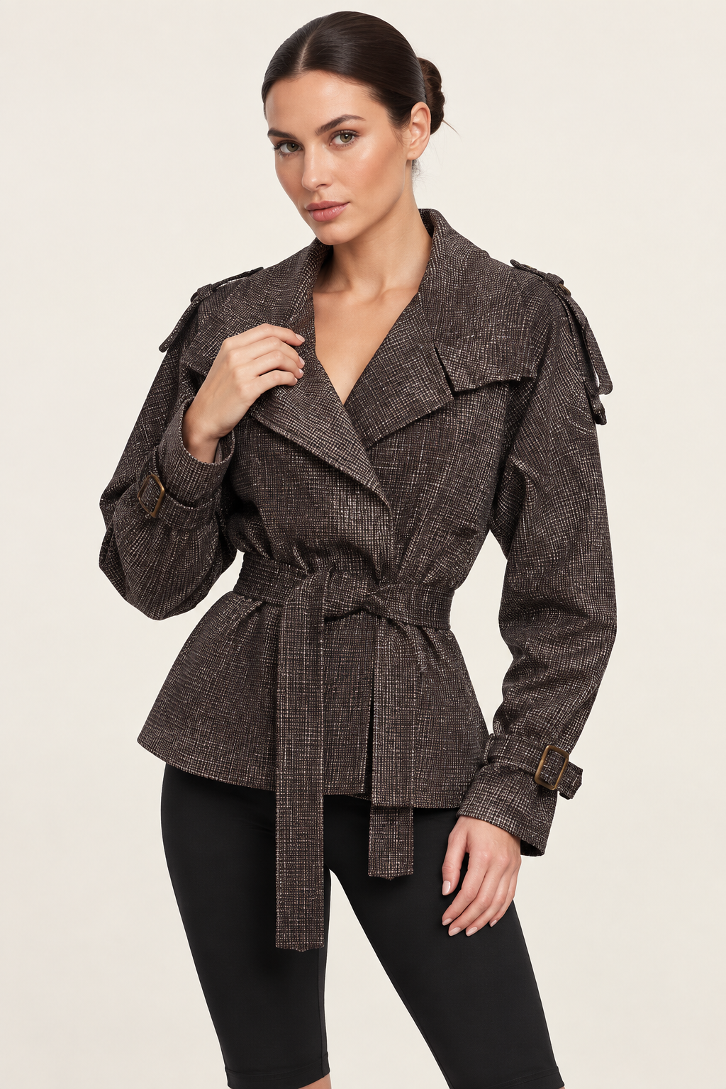 Close-up studio view of the dark check jacket