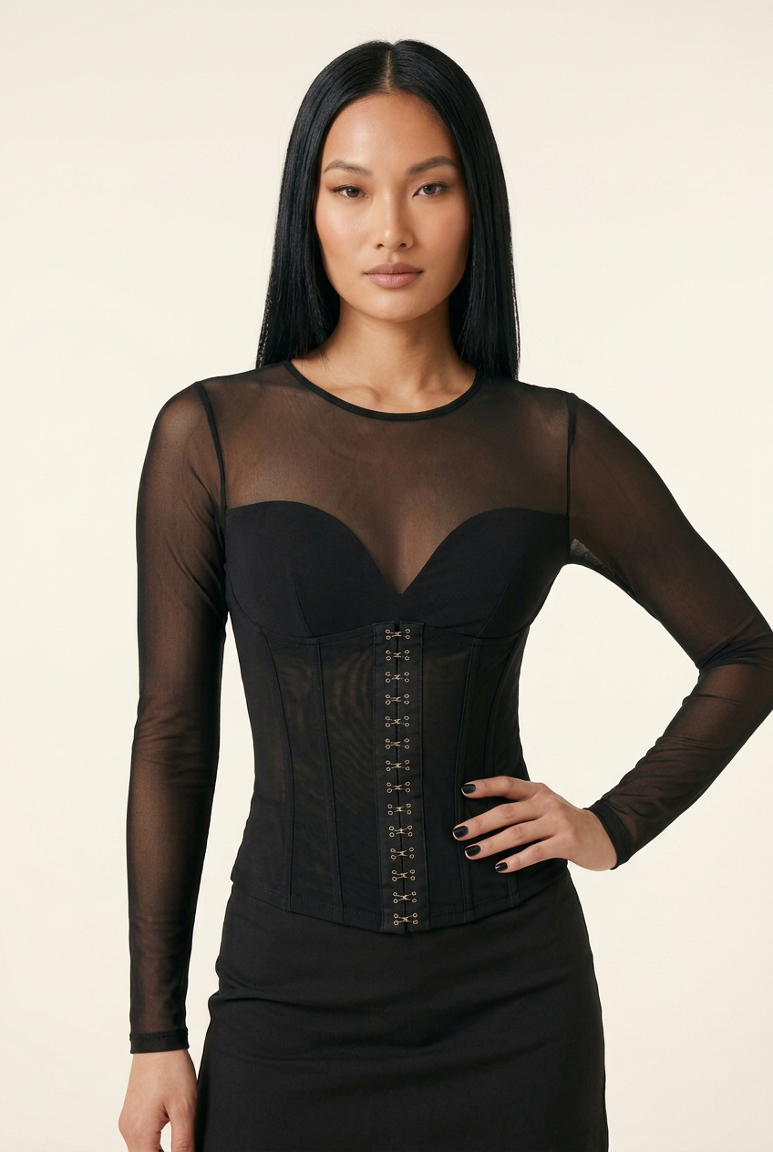Front-facing close-up of the black mesh corset-style top, with a new hand-on-hip pose
