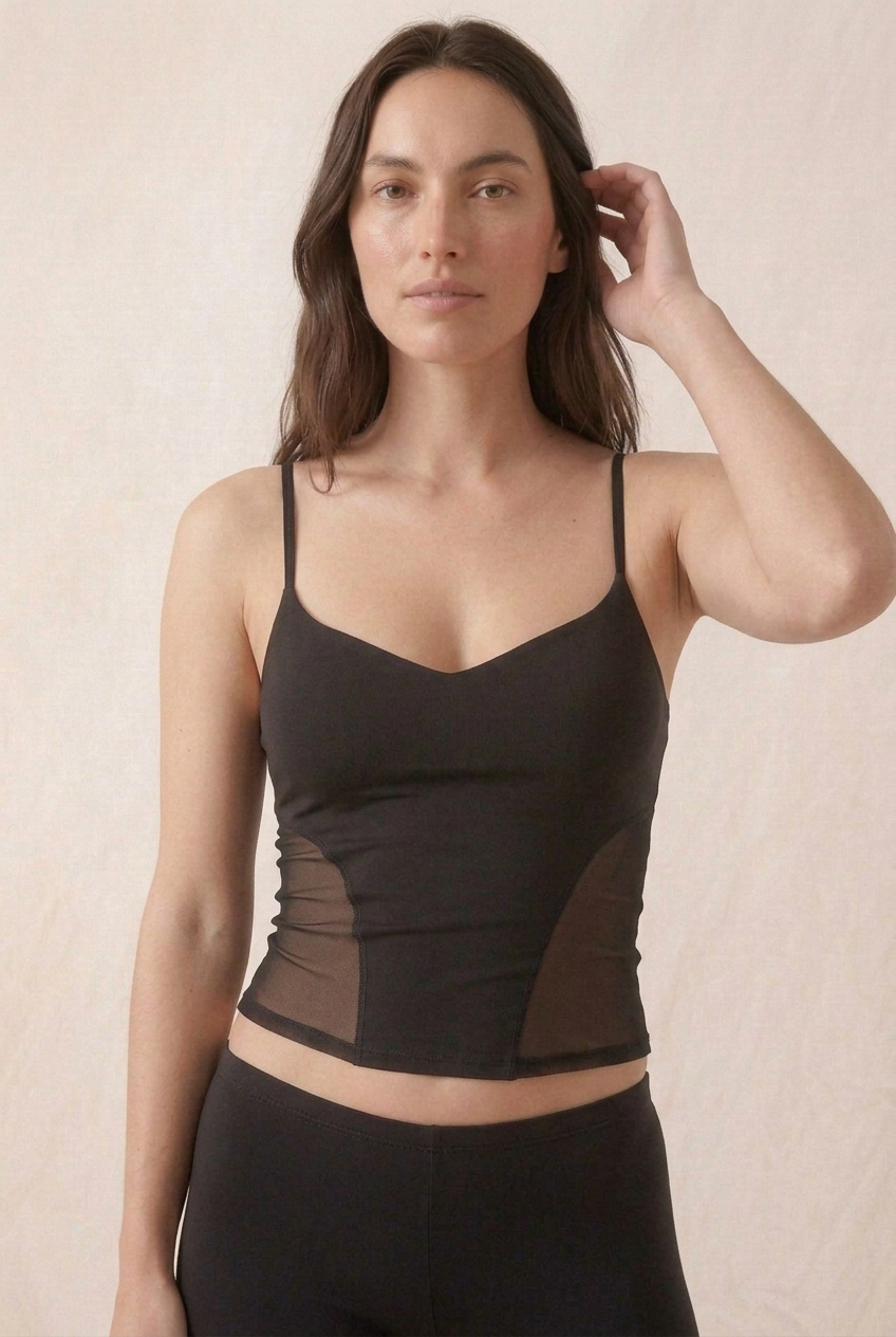 Front-facing close-up of the black mesh-side cami with the brunette model in a new pose