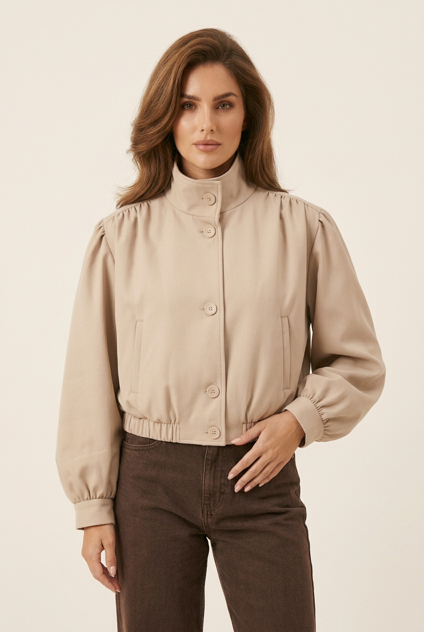 Front-facing jacket close-up with the brunette model in a new hand-at-waist pose