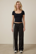 Front studio view of the striped trouser outfit on the blonde model