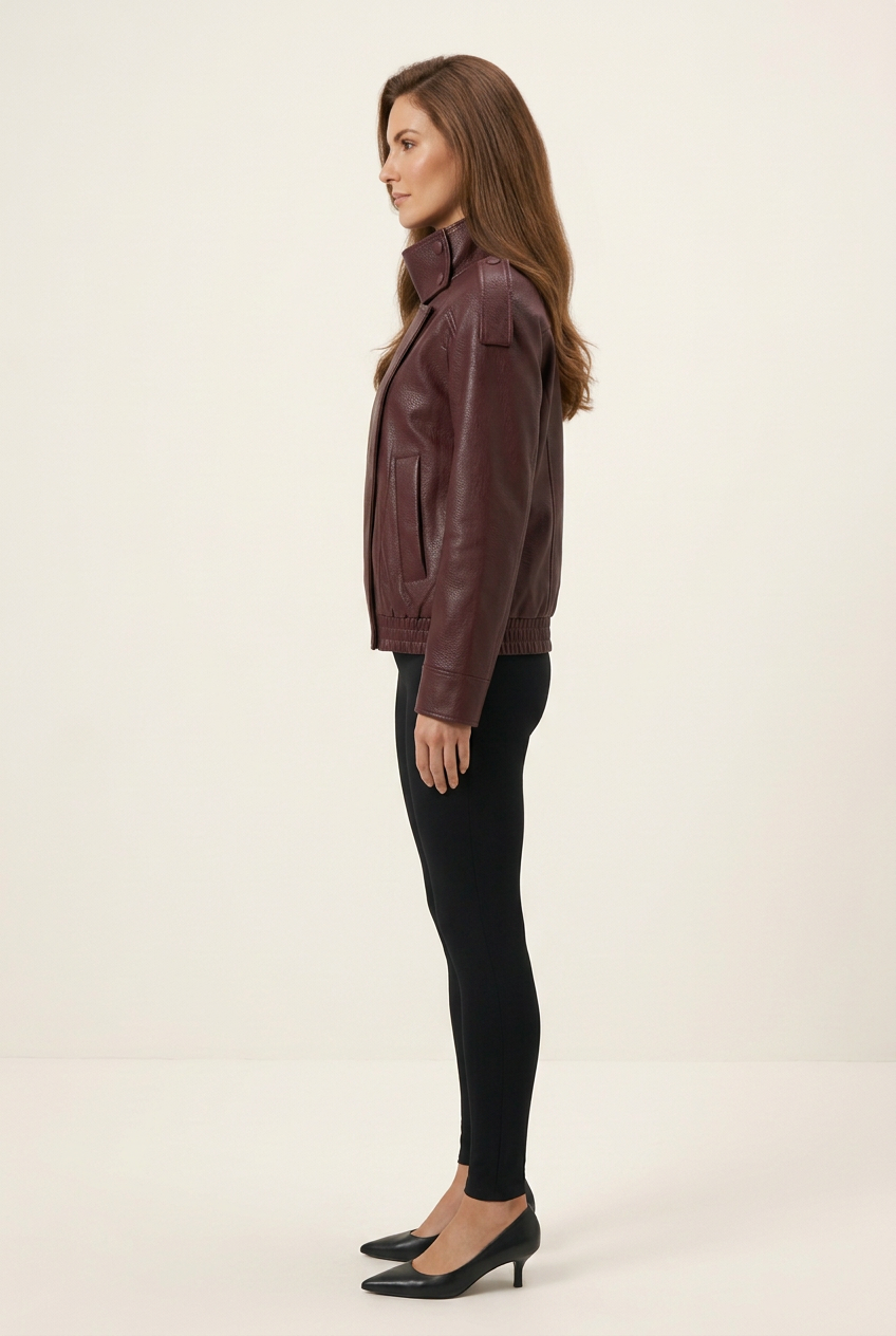 Full-length studio side profile with the jacket, black leggings and pointed-toe kitten heels