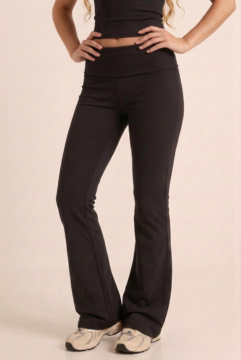 Leggings close-up with the blonde brand model, retaining the waist-to-floor crop