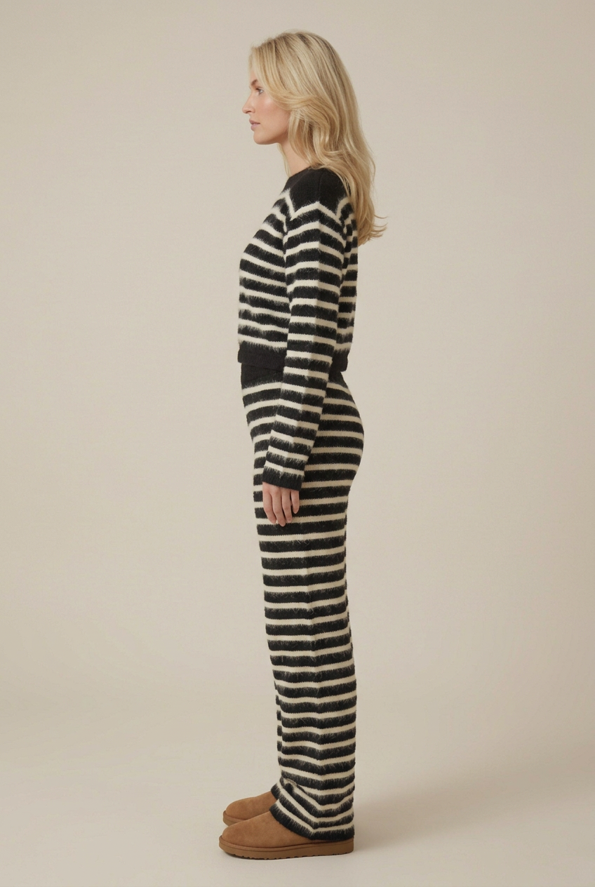 Side profile of the blonde model in the striped fluffy knit set