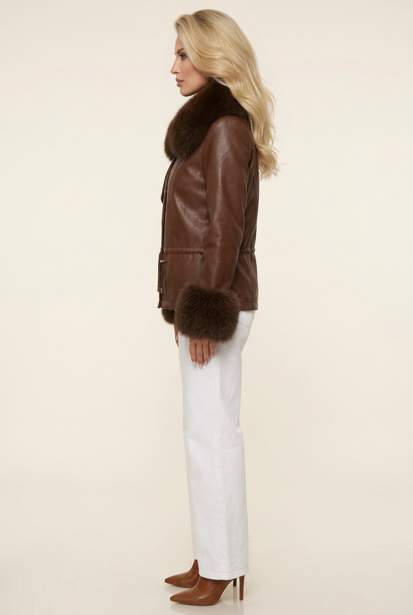 Side-profile studio image of the brown coat with white wide-leg jeans and brown heeled boots