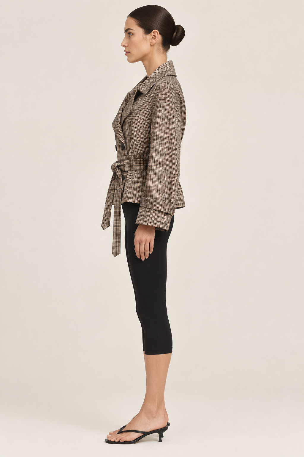 Side-profile studio view of the checked jacket