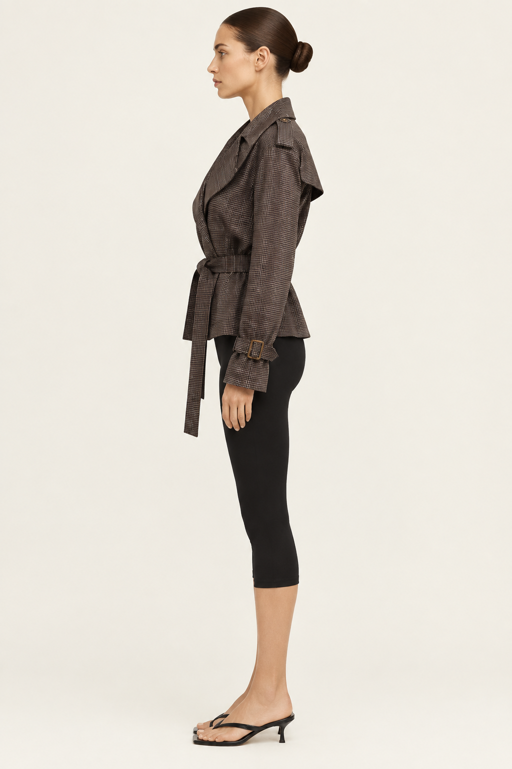 Side-profile studio view of the dark check jacket