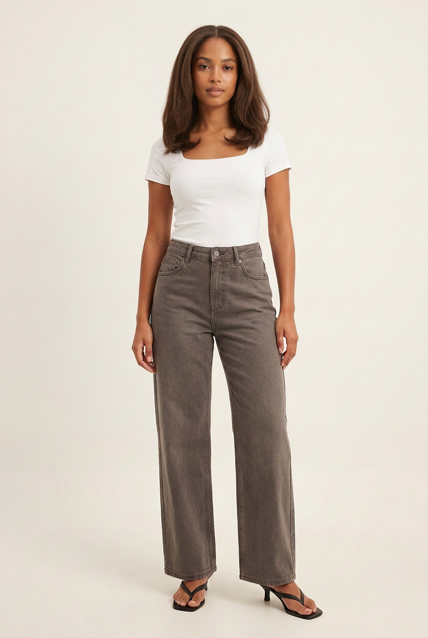 Updated studio image with a natural brunette blowout and slightly longer jeans draping over the shoes